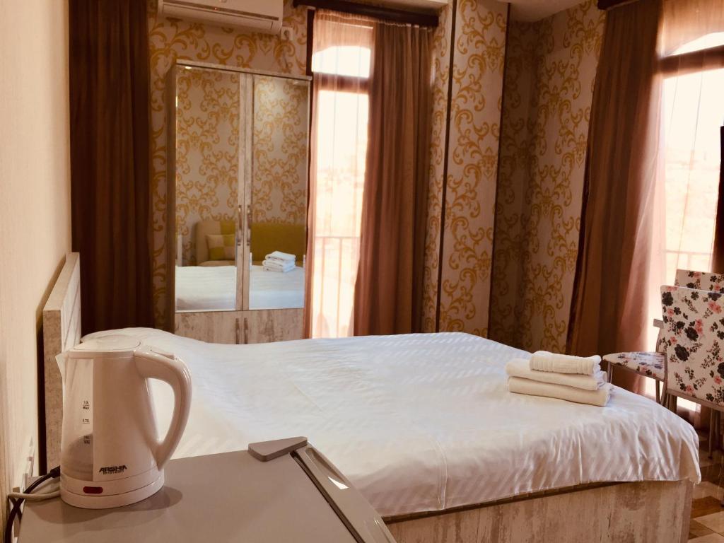 Postel nebo postele na pokoji v ubytování Hotel Tourist