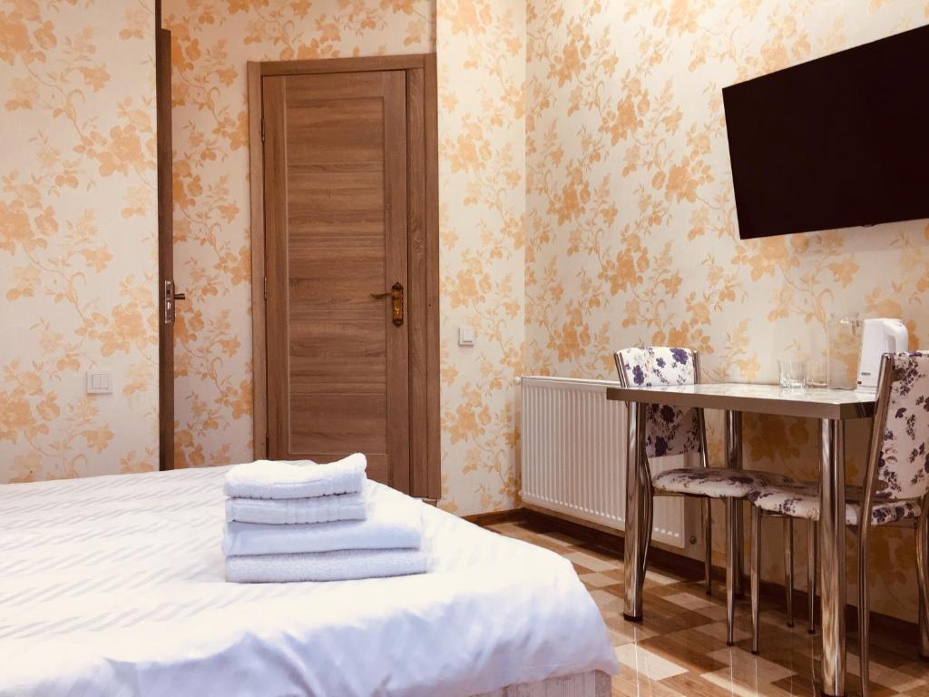 Postel nebo postele na pokoji v ubytování Hotel Tourist