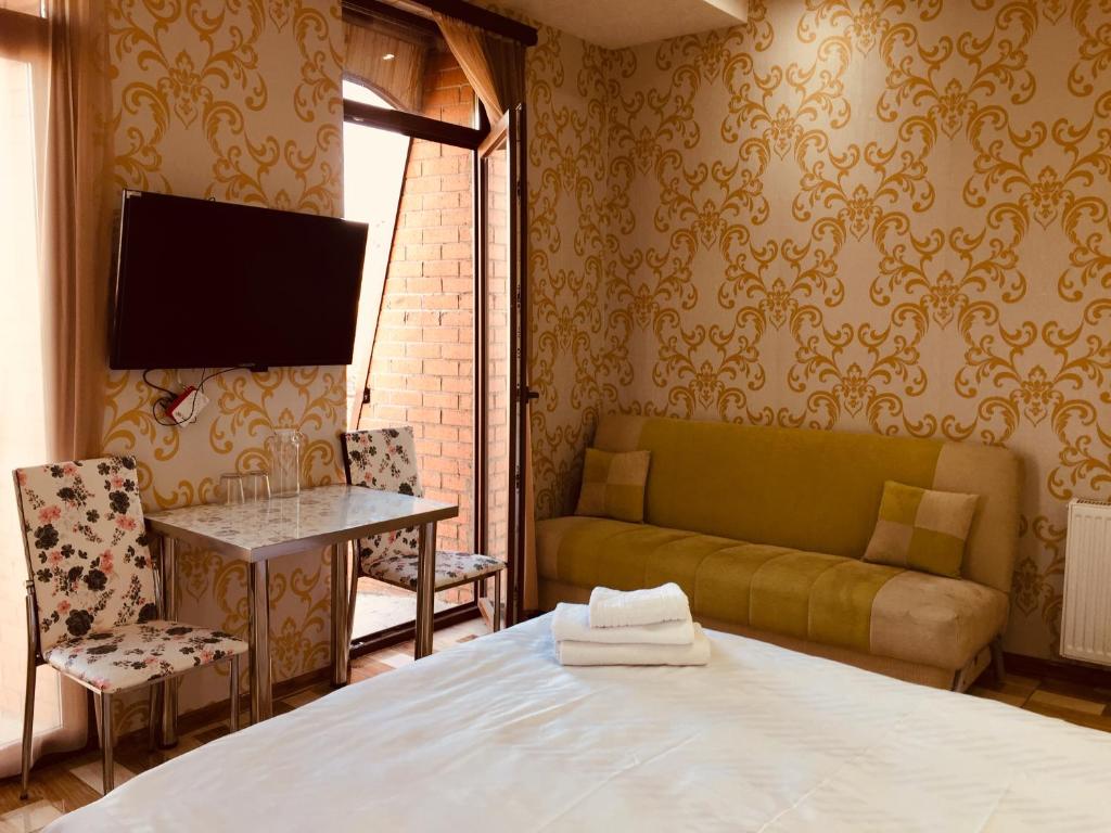 TV a/nebo společenská místnost v ubytování Hotel Tourist