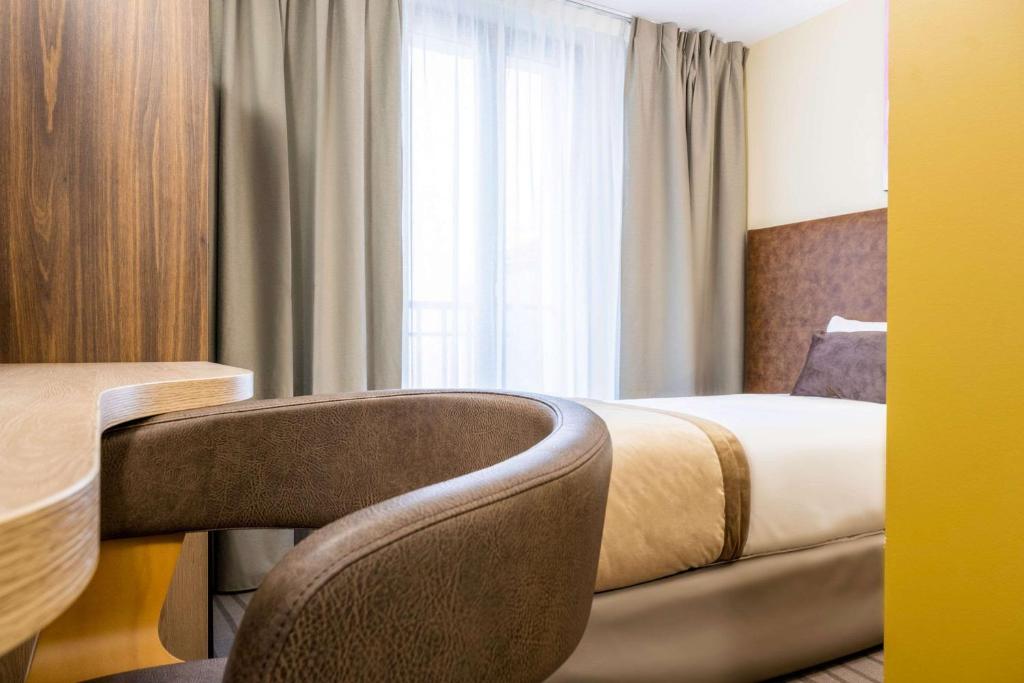 Postel nebo postele na pokoji v ubytování Quality Hotel Toulouse Centre