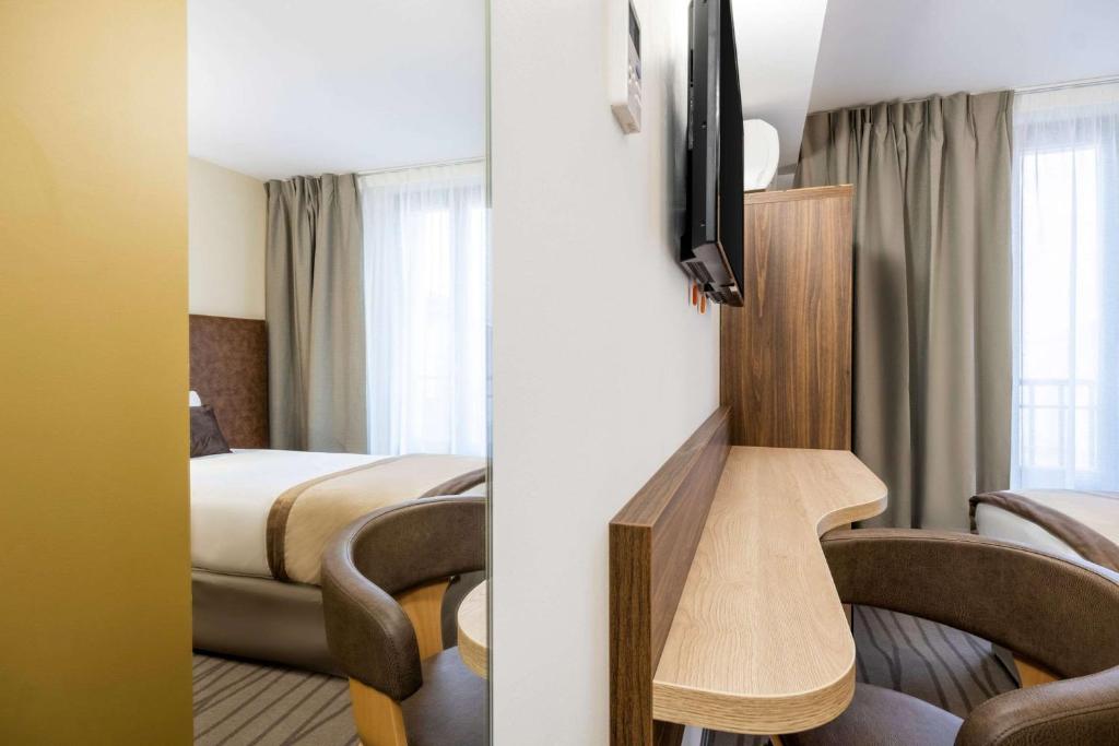 Postel nebo postele na pokoji v ubytování Quality Hotel Toulouse Centre