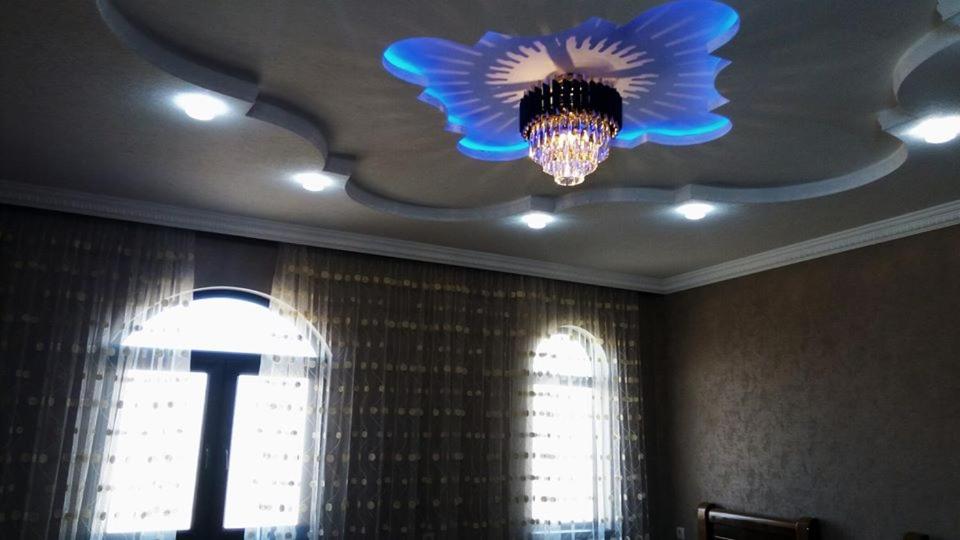 a ceiling with a chandelier in a room with a window at Gricko in Tbilisi City