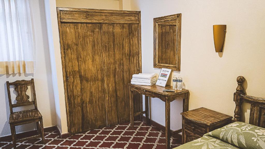 Postel nebo postele na pokoji v ubytování Hotel Alhóndiga