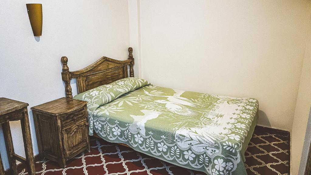Postel nebo postele na pokoji v ubytování Hotel Alhóndiga