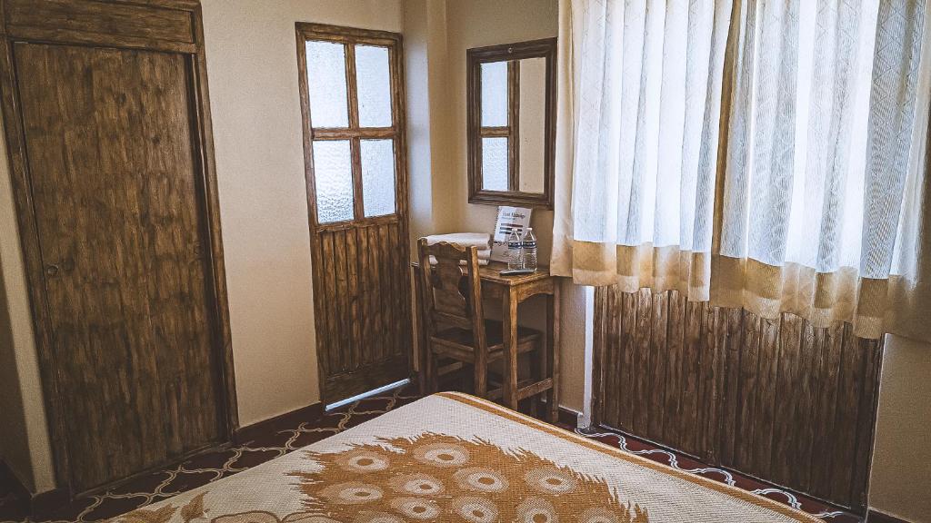 Postel nebo postele na pokoji v ubytování Hotel Alhóndiga