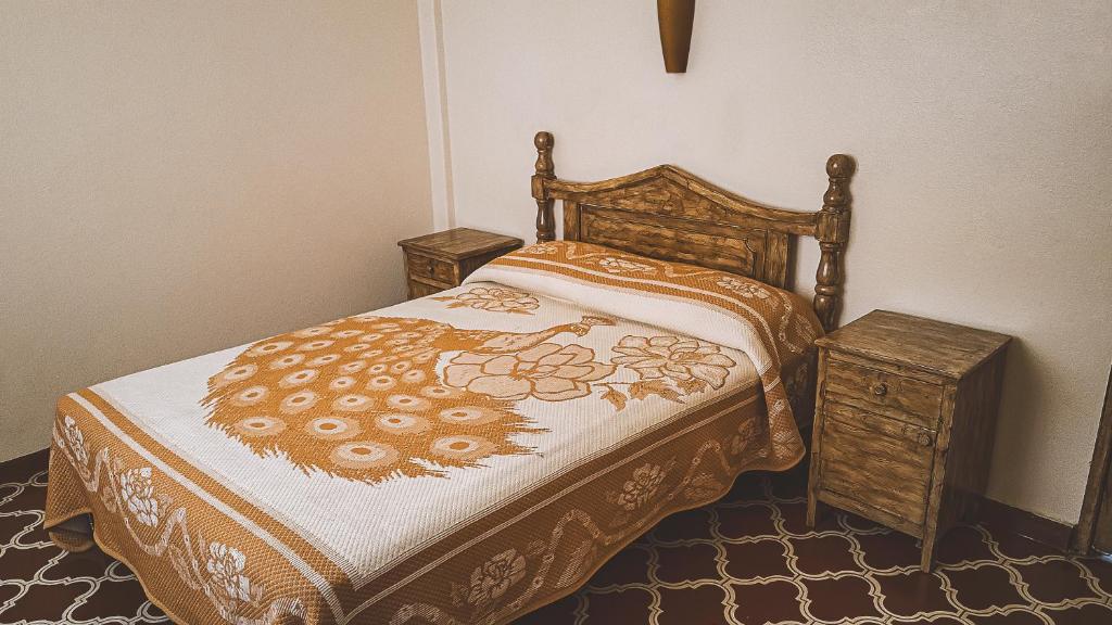 Postel nebo postele na pokoji v ubytování Hotel Alhóndiga