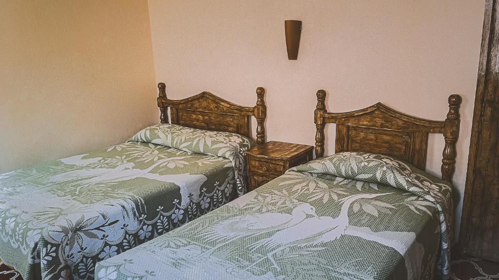 Postel nebo postele na pokoji v ubytování Hotel Alhóndiga