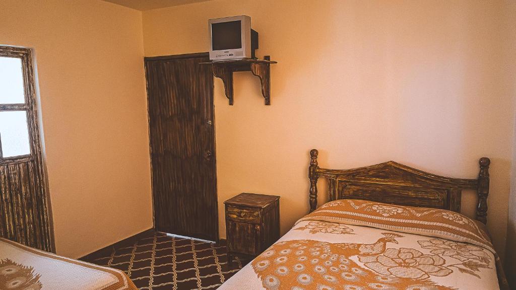 Postel nebo postele na pokoji v ubytování Hotel Alhóndiga