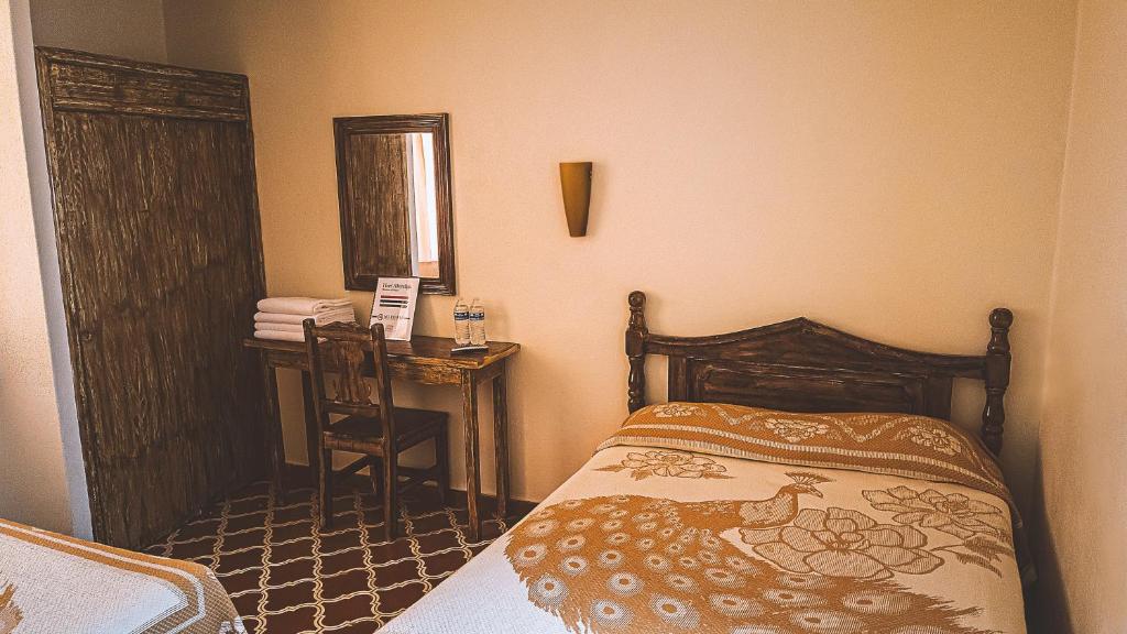 Postel nebo postele na pokoji v ubytování Hotel Alhóndiga