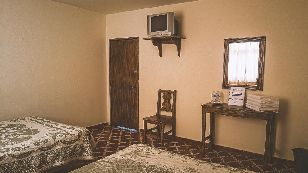 Postel nebo postele na pokoji v ubytování Hotel Alhóndiga