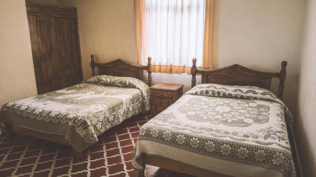Postel nebo postele na pokoji v ubytování Hotel Alhóndiga