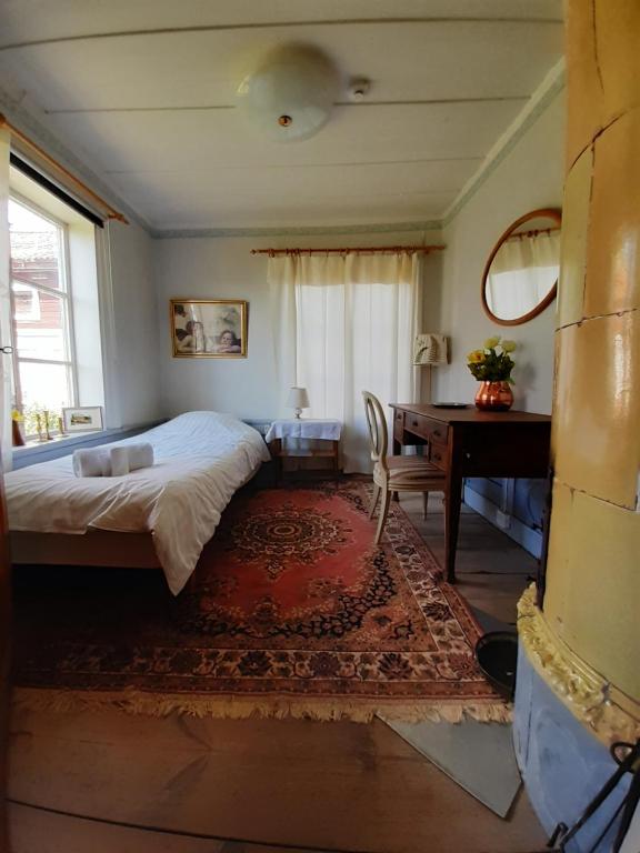 Postel nebo postele na pokoji v ubytování Frägsta Hälsingegård B&B