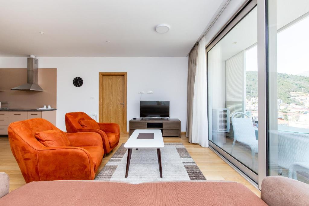 O zonă de relaxare la Apartments LORA in Apart-hotel