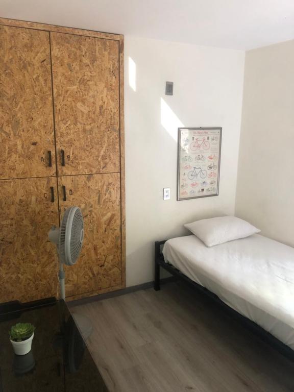 Postel nebo postele na pokoji v ubytování Hostal Hidalgo