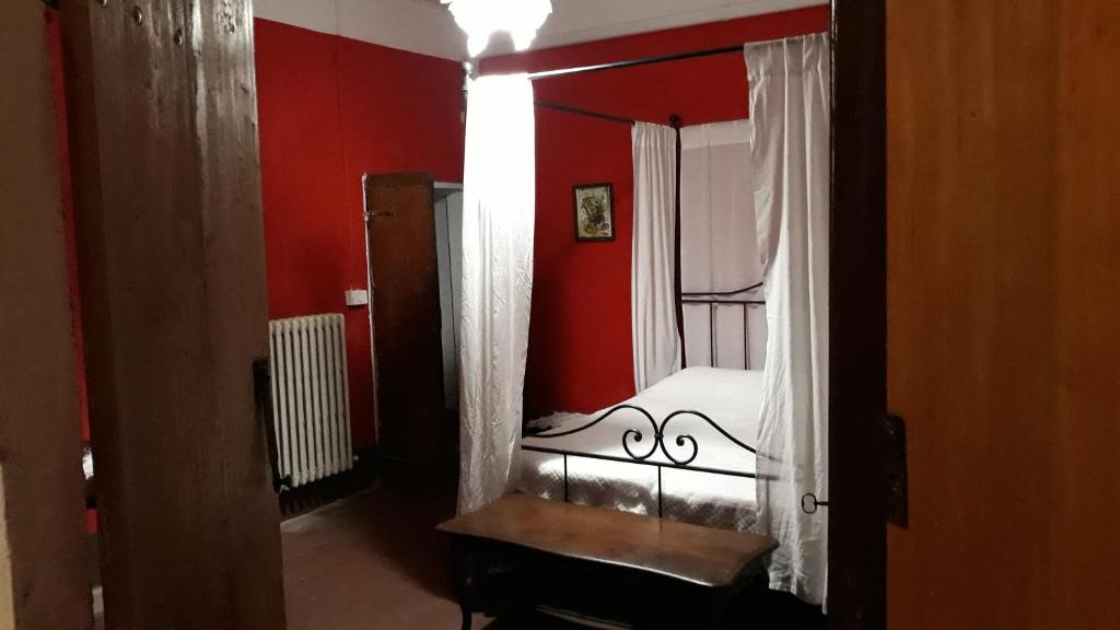 Postel nebo postele na pokoji v ubytování Agriturismo Olivazzi
