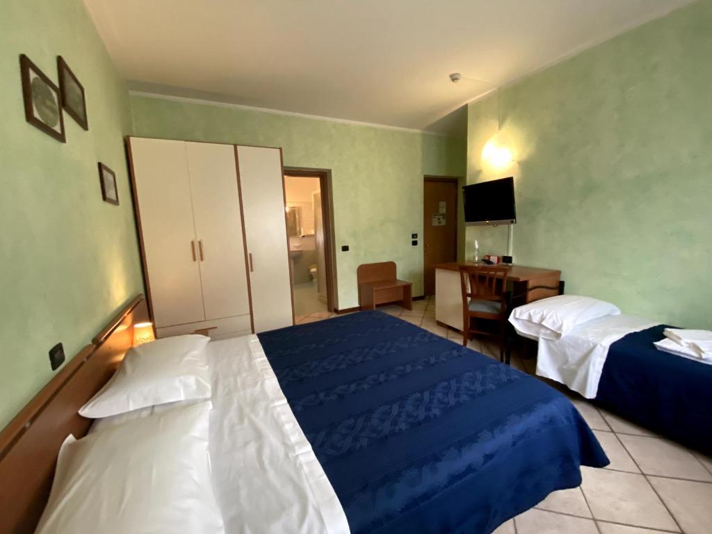 Postel nebo postele na pokoji v ubytování Sole della Franciacorta - Hotel & Restaurant
