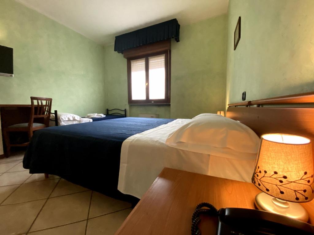 Postel nebo postele na pokoji v ubytování Sole della Franciacorta - Hotel & Restaurant