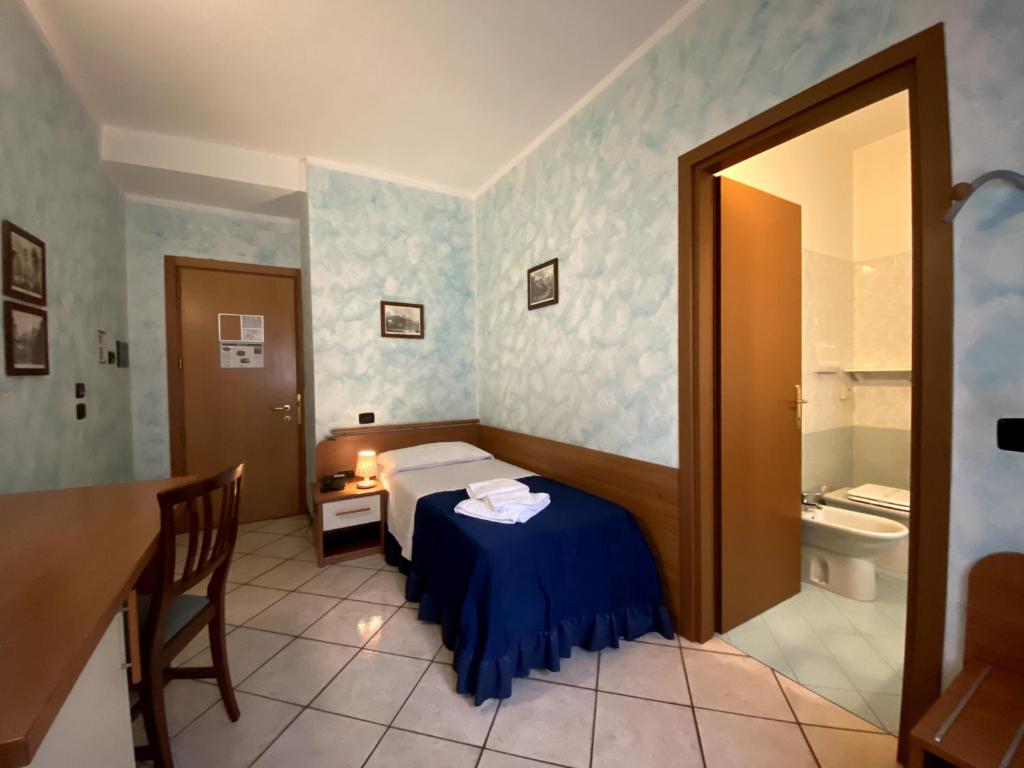 Postel nebo postele na pokoji v ubytování Sole della Franciacorta - Hotel & Restaurant