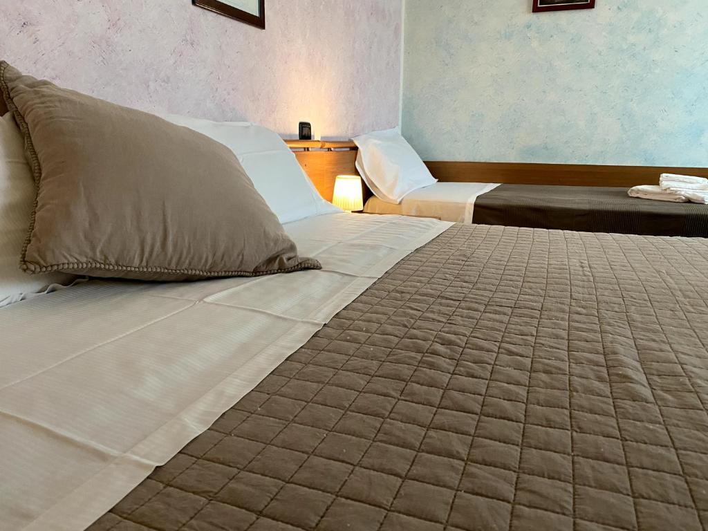 Postel nebo postele na pokoji v ubytování Sole della Franciacorta - Hotel & Restaurant