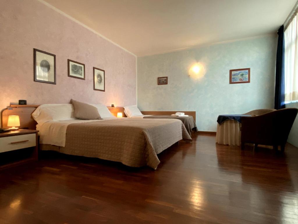 Postel nebo postele na pokoji v ubytování Sole della Franciacorta - Hotel & Restaurant