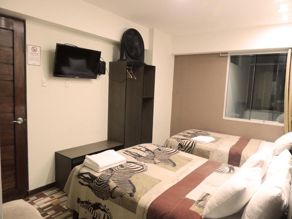 Postel nebo postele na pokoji v ubytování Hotel Coronado