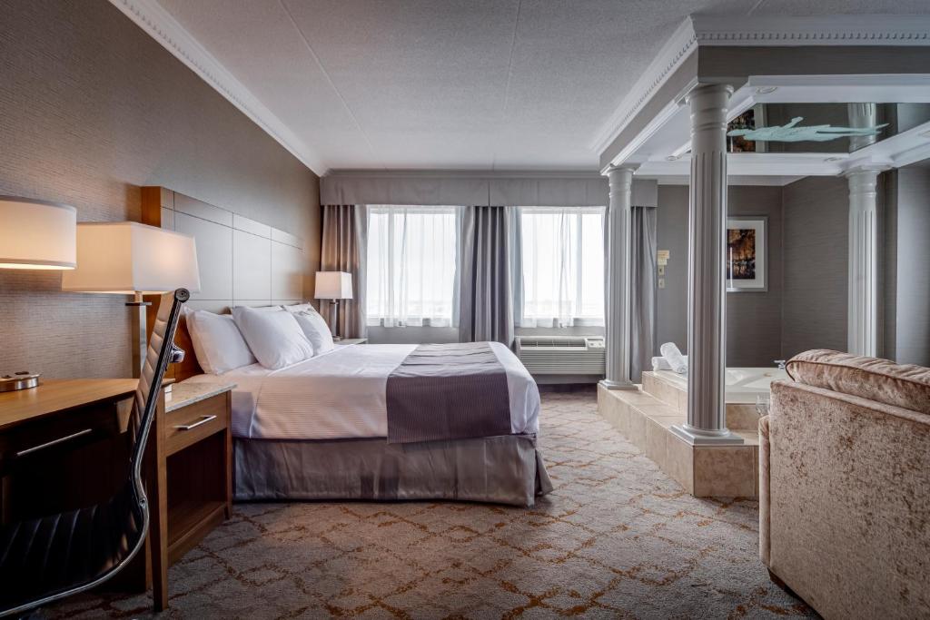 Voodi või voodid majutusasutuse Monte Carlo Inn Vaughan Suites toas