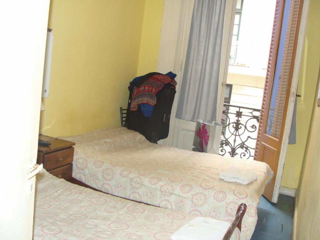 Postel nebo postele na pokoji v ubytování Hotel O'Rei