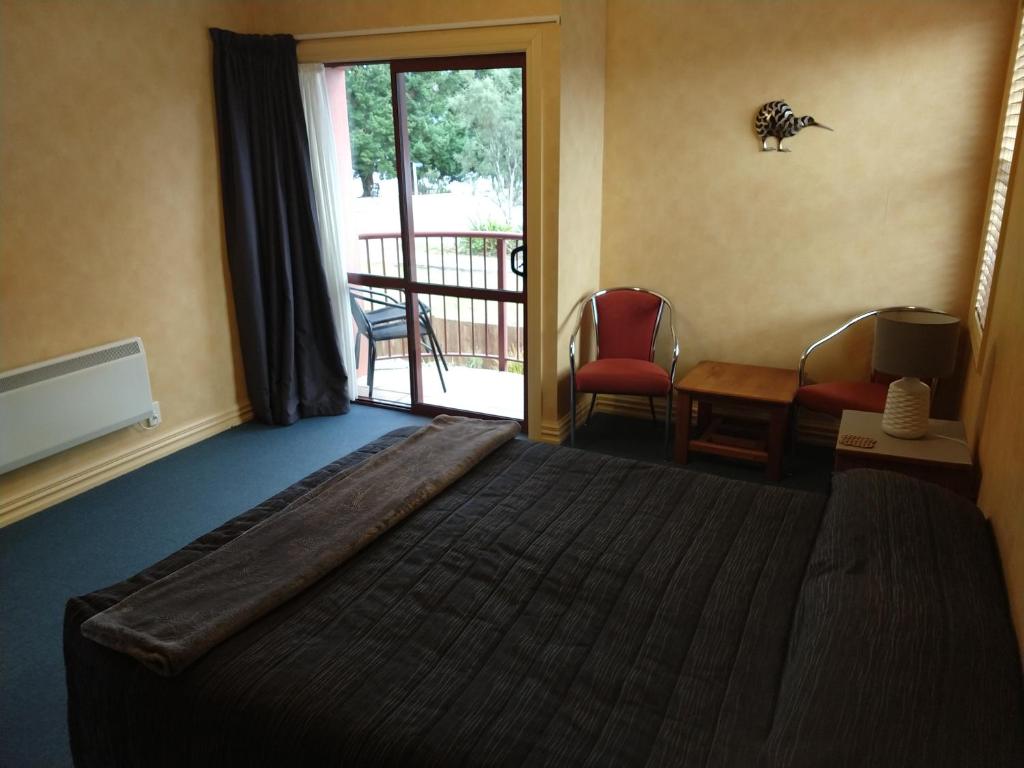 Postel nebo postele na pokoji v ubytování Red Tussock Motel