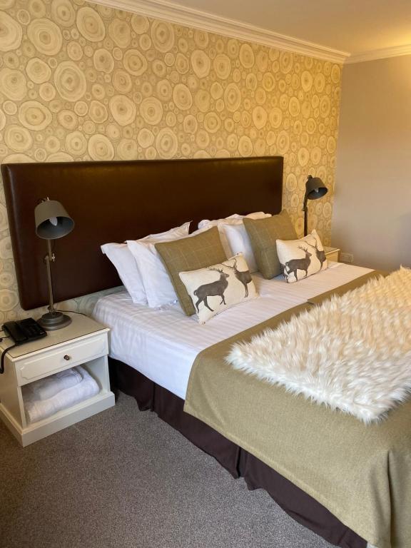 two beds in a hotel room with two beds sidx sidx sidx at No12 Hotel in North Berwick