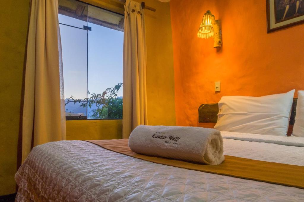 Postel nebo postele na pokoji v ubytování Hotel Kuntur Wassi