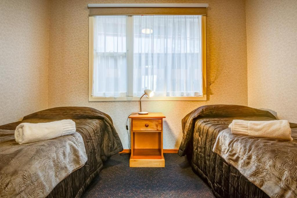 Postel nebo postele na pokoji v ubytování Red Tussock Motel