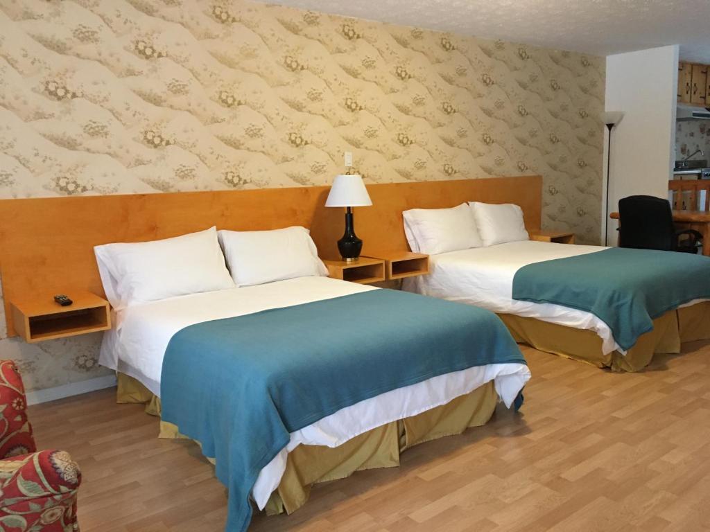 Postel nebo postele na pokoji v ubytování Motel le Sabre