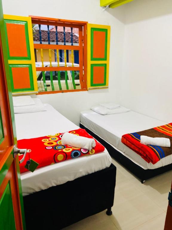 Postel nebo postele na pokoji v ubytování casa hostal las palmeras