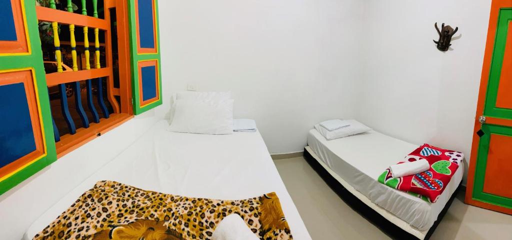 Postel nebo postele na pokoji v ubytování casa hostal las palmeras