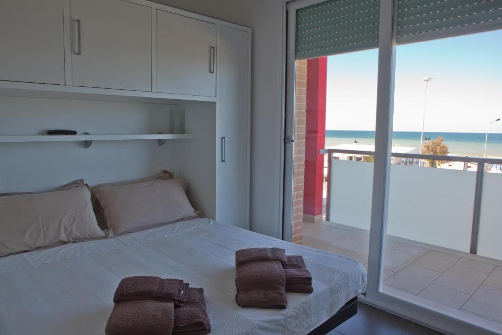 Postel nebo postele na pokoji v ubytování Residence La Nave