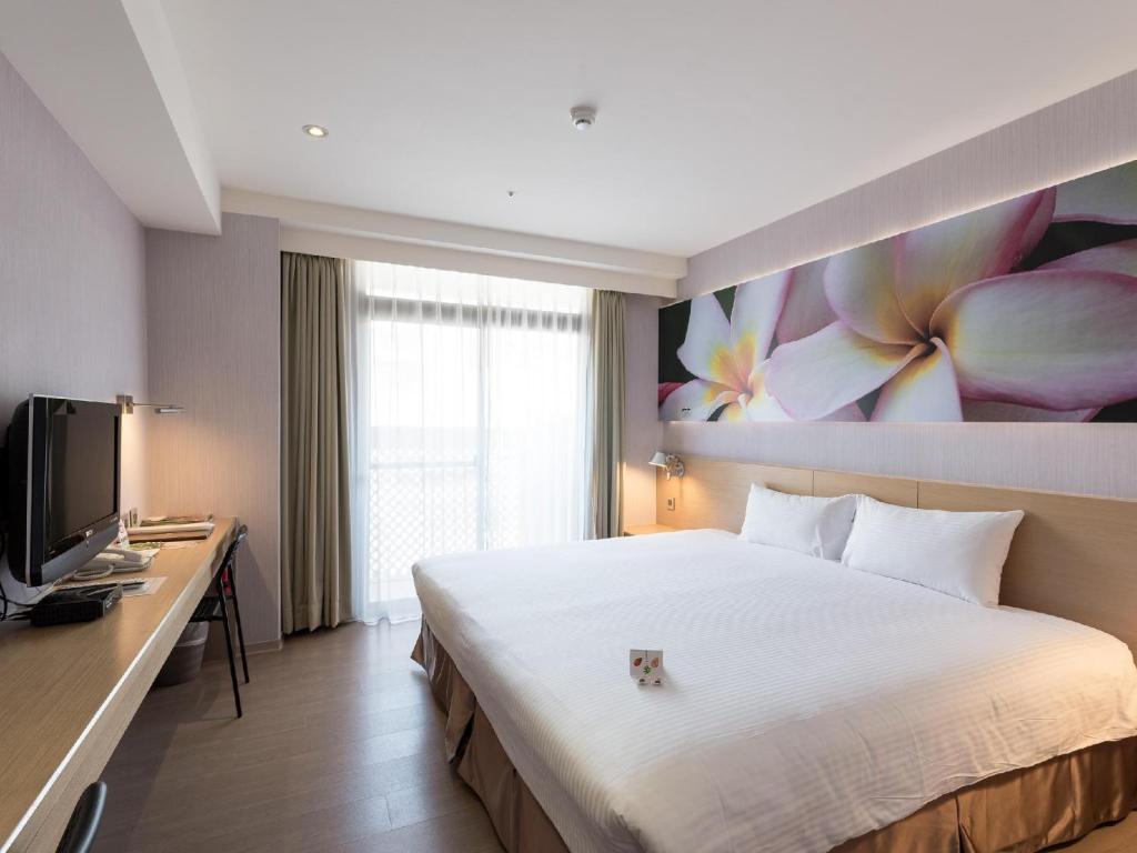 TV a/nebo společenská místnost v ubytování Mellow Fields Hotel
