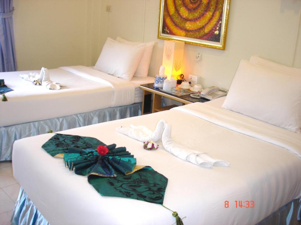 Postel nebo postele na pokoji v ubytování Lamai Apartment