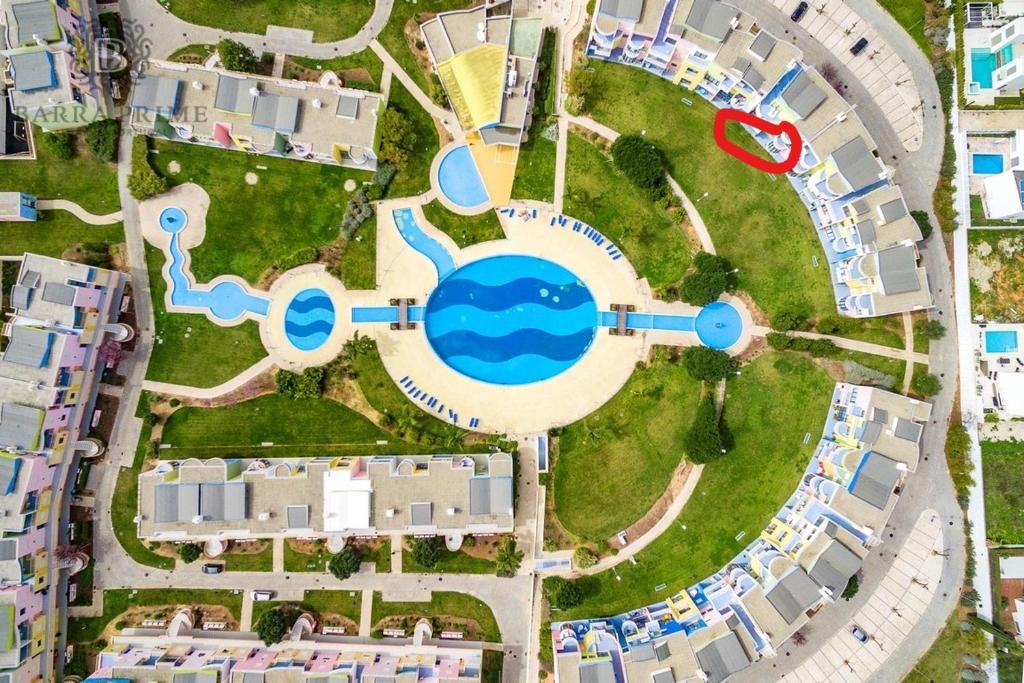 an overhead view of a pool at a resort at Marina de Albufeira Orada Resort - 2-bed apartment with huge pool in Albufeira