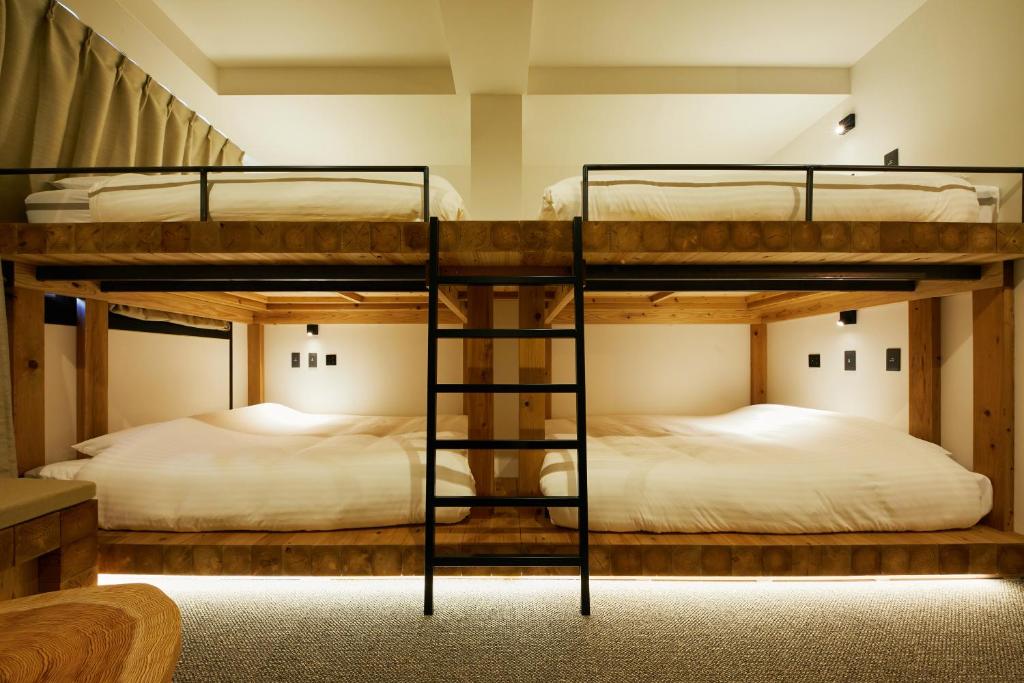 Postel nebo postele na pokoji v ubytování mizuka Daimyo 7 - unmanned hotel -