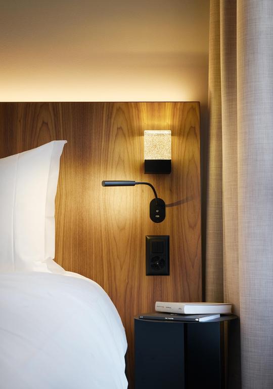 Llit o llits en una habitació de Sorell Hotel Zürichberg
