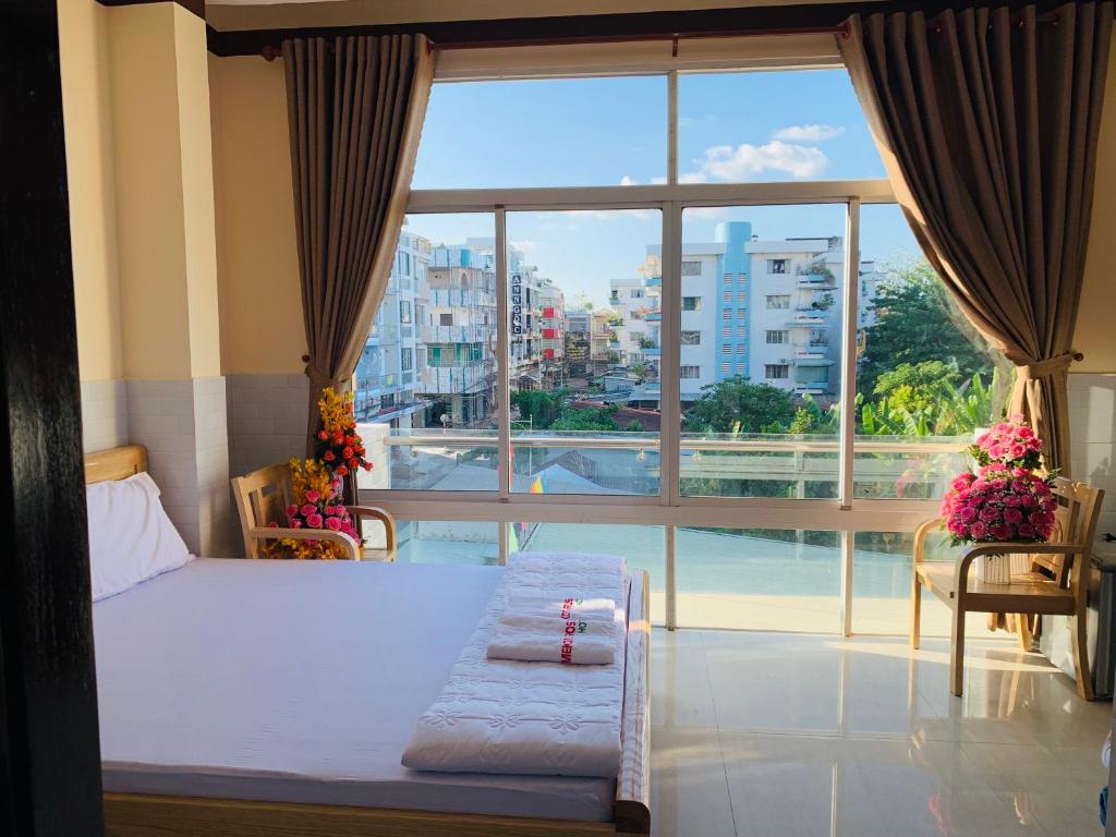 Giường trong phòng chung tại Mekong Rose Hotel