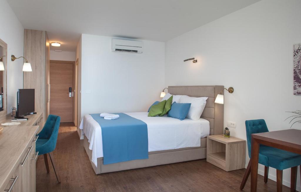 Postel nebo postele na pokoji v ubytování Villa Cascada