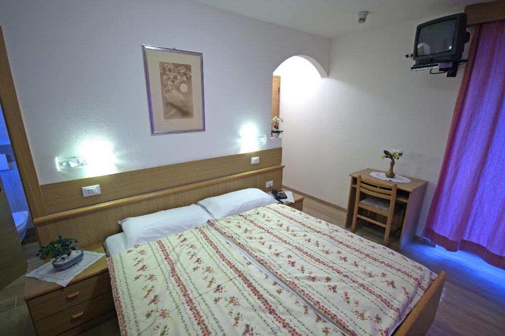 Postel nebo postele na pokoji v ubytování Hotel La Molinella