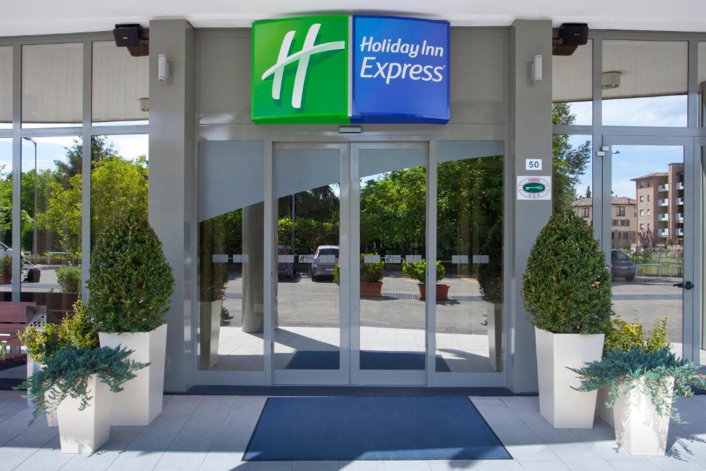 
a sign on the side of a building at Holiday Inn Express Parma, an IHG Hotel in Parma
