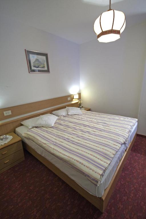 Postel nebo postele na pokoji v ubytování Hotel La Molinella