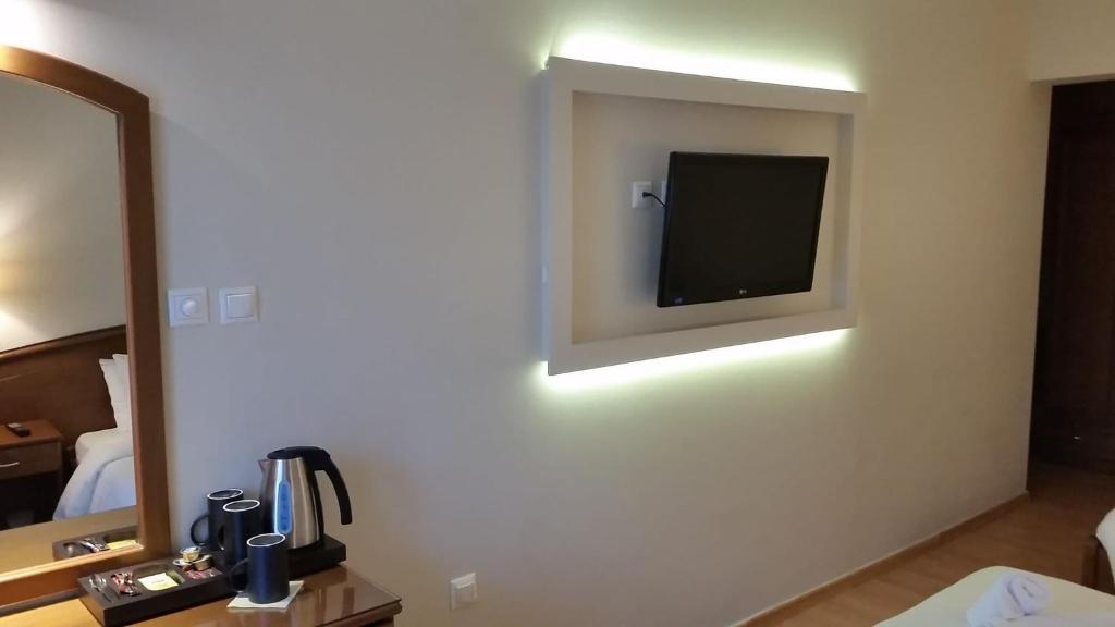 Postel nebo postele na pokoji v ubytování Xenios Dias Boutique Hotel