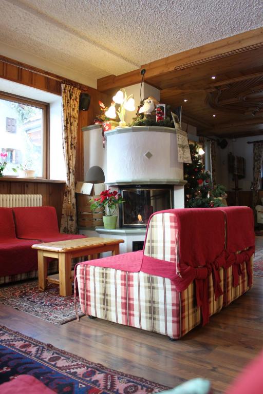Posezení v ubytování Hotel Bouton D'Or - Cogne