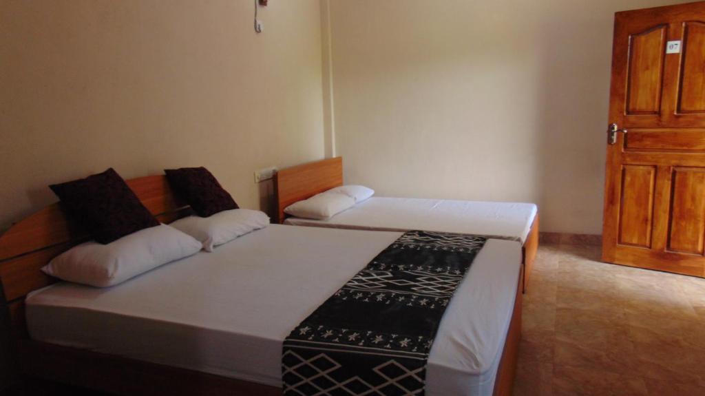 Postel nebo postele na pokoji v ubytování Hotel Alas Garden