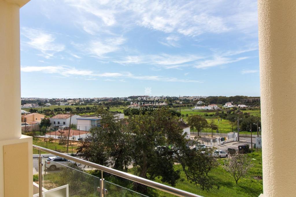 a view of a city from a balcony at Vila Encosta dos Salgados- F By Dalma Portuguesa in Guia