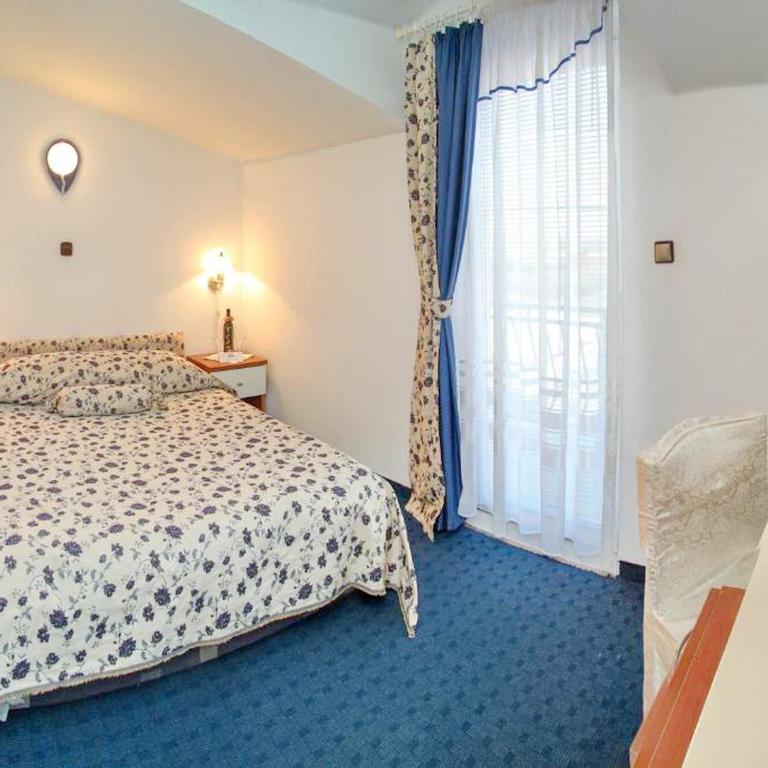 Postel nebo postele na pokoji v ubytování Hotel Villa Neretva - Metković